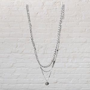 8” choker with 3 layers and a silver disc